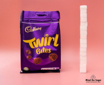 One Bag of Cadbury Twirl Bite contains 63.2g of sugar, equivalent to 15.8 sugar cubes A photo of Cadbury Twirl Bite bag with 15.8 cubes of sugar.