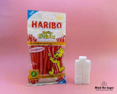 One pack (75g) of Haribo Balla Stixx contains 43.5g of sugar, equivalent to 10.9 sugar cubes A photo of Haribo Balla Stixx (75g) with 10.9 cubes of sugar.
