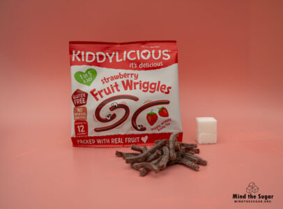 One pack of Kiddylicious Strawberry Fruit Wriggles contains 8.3g of sugar, equivalent to 2.1 sugar cubes A photo of Kiddylicious Strawberry Fruit Wriggles pack with 2.1 cubes of sugar.