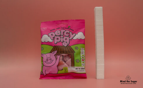 One bag of M&S Percy Pig Fruit Gums contains 58,8g of sugar, equivalent to 14,7 sugar cubes A photo of a bag of M&S Percy Pig Fruit Gums with 14,7 cubes of sugar